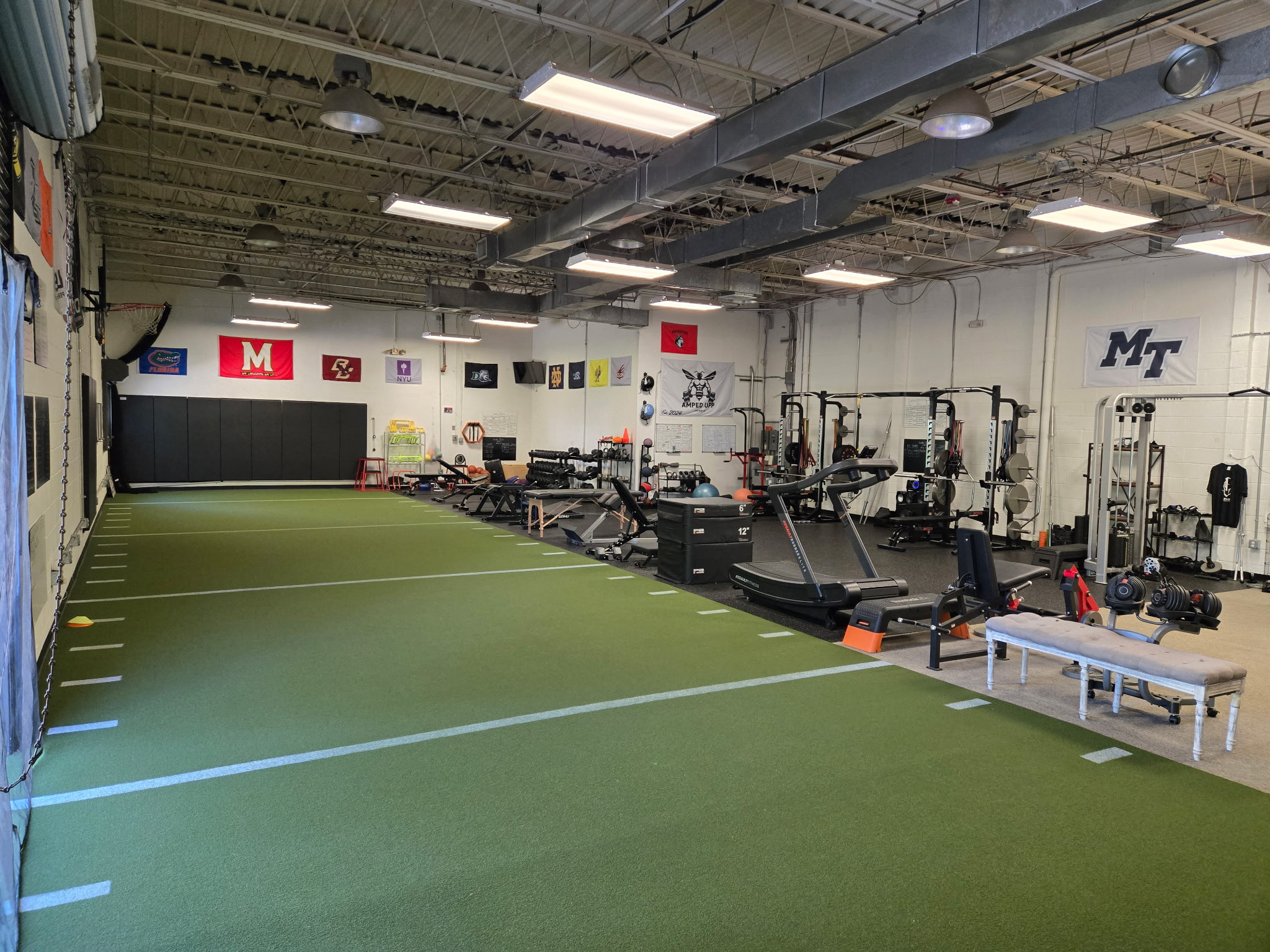 The turf training area and strength equipment at Depugh Performance and Fitness
